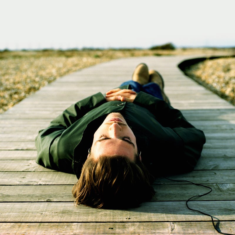 https://www.gettyimages.com/detail/photo/man-lying-on-boardwalk-listening-to-high-res-stock-photogra...