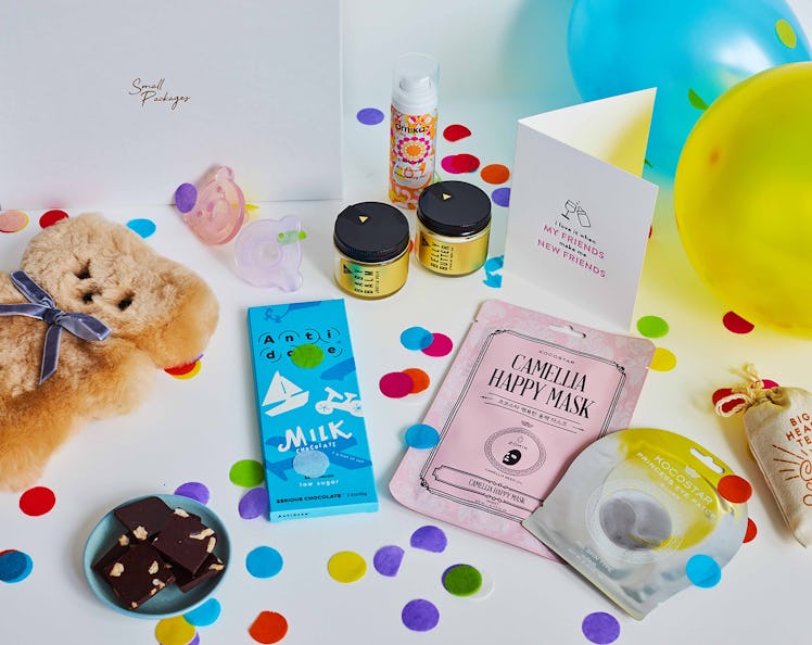 A package from Small Packages includes all kinds of celebratory goodies, chocolate, and snacks.