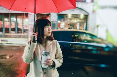 Young Asian woman on rainy day
