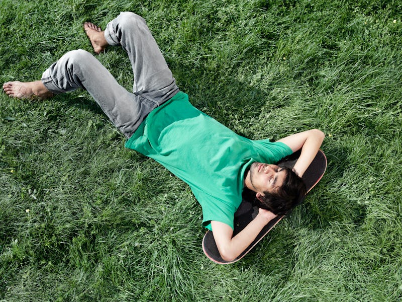 A man lying on grass