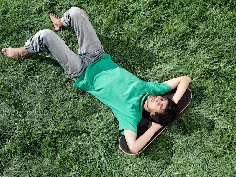 A man lying on grass 