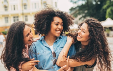 Three women laughing