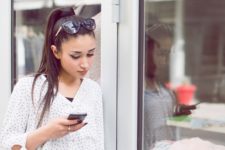 Annoyed girl texting