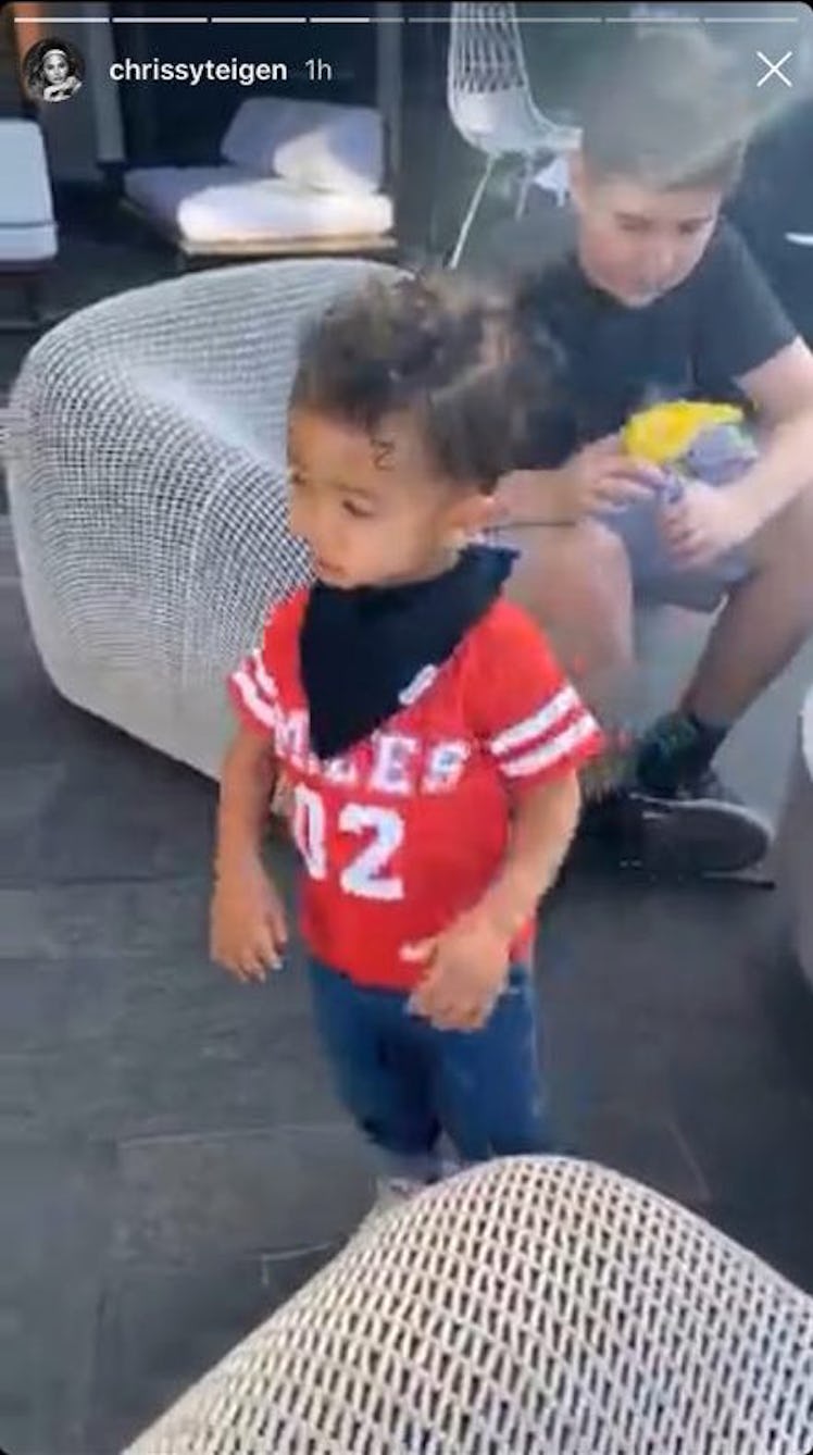 Miles dressed in a red jersey with #2