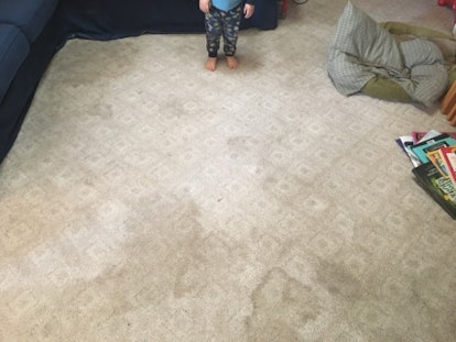 A dirty carpet and some toddler feet