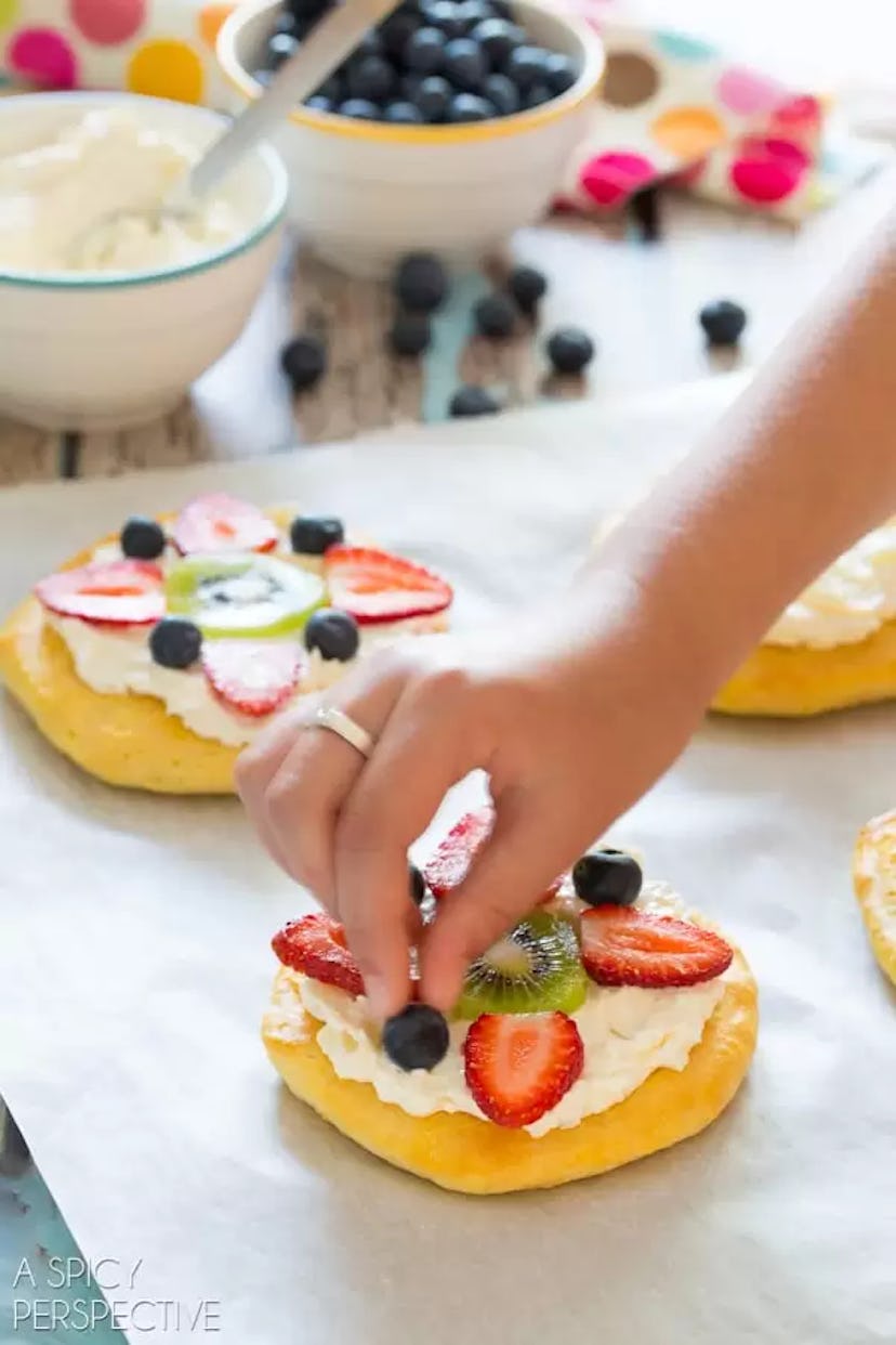Breakfast fruit pizza is a festive Valentine's Day breakfast for kids who love toppings.