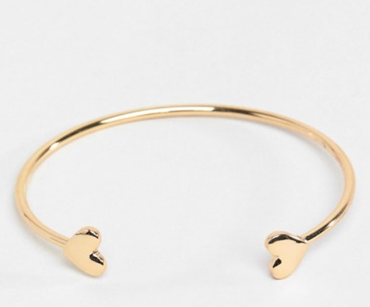 ASOS DESIGN cuff bracelet with heart detail in gold