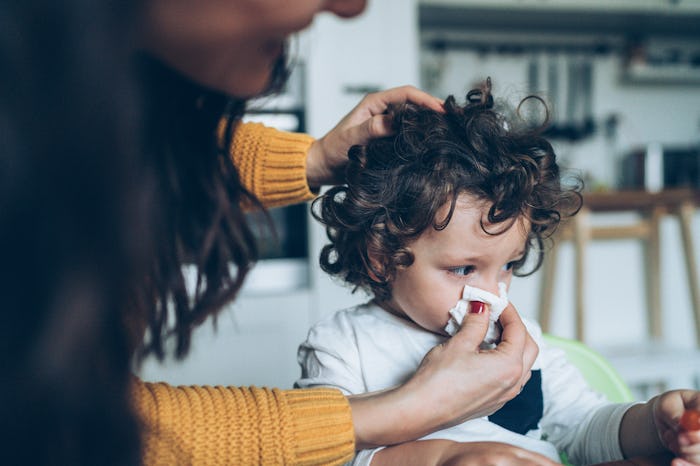Mom blows toddler's nose