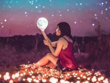 Girl holding supermoon