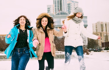 Three women leaping for joy in snow