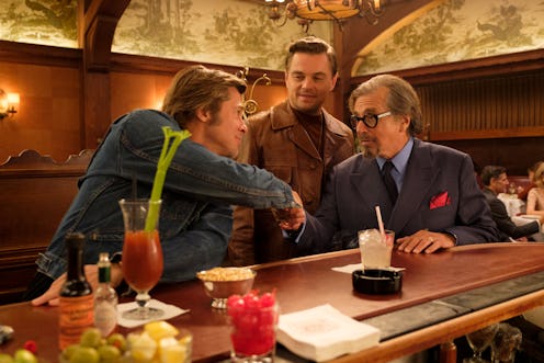 Brad Pitt as Cliff Booth, Leonardo DiCaprio as Rick Dalton, and Al Pacino as Marvin Schwarz drinking...