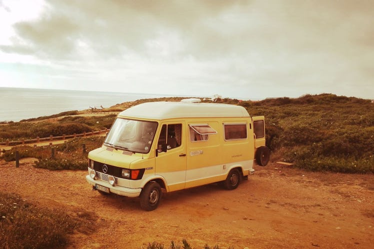The Aurora Campervan has a yellow exterior and is located in a national park in Portugal.