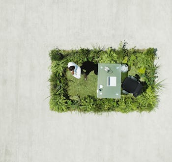 A view from above on the office set on green surface