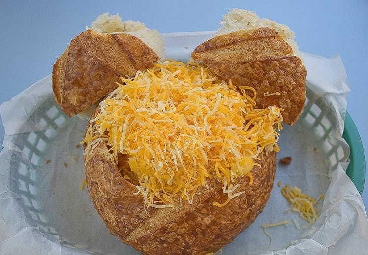An off the menu chili mac 'n' cheese in a Mickey Mouse-shaped bread bowl sits on a table at Disneyla...