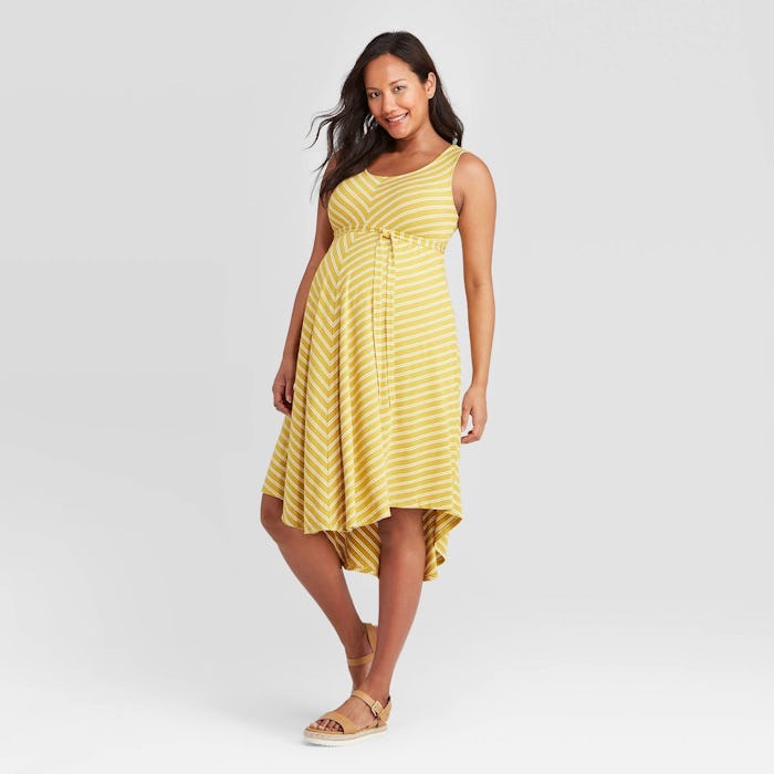 Pregnant model wearing a spring maternity dress from Target
