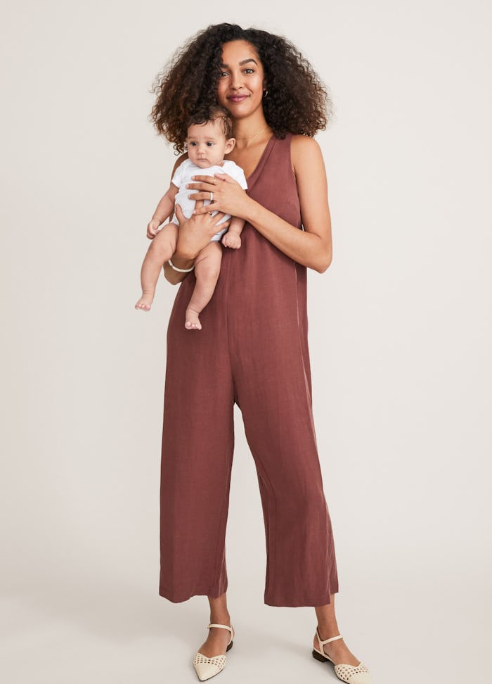 a woman holding her baby wearing clothes from HATCH's fourth trimester collection
