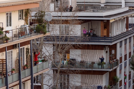people sing from their balconies in italy while isolated for covid-19