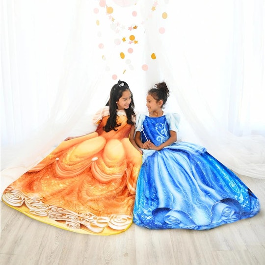 Two girls wearing Disney Blankie Tails, one in Belle gown the other in Cinderella gown