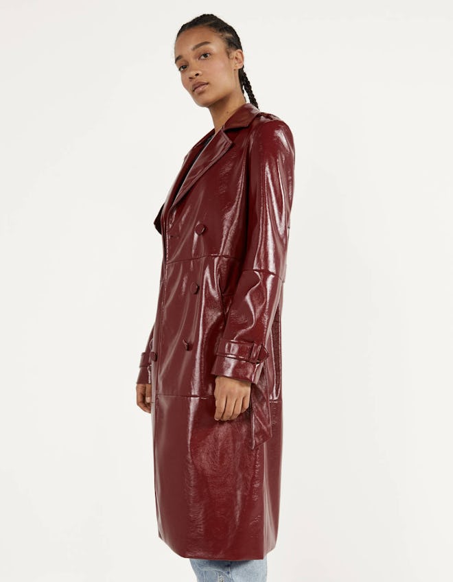 Double-breasted vinyl trench coat