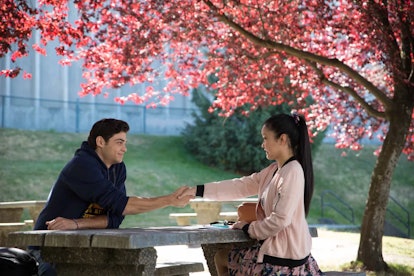 Noah Centineo and Lana Condor sitting together in "To All The Boys I've Loved Before" movie