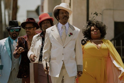Rudy Ray Moore wearing a white suit in "Dolemite Is My Name"