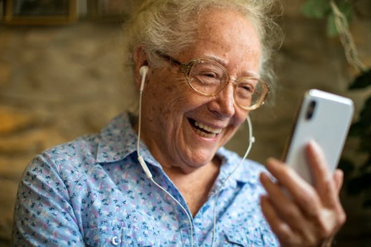Cheerful senior woman making a video call
