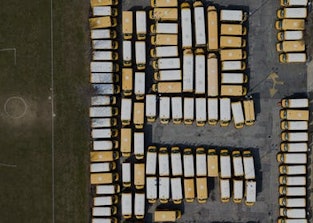 Parked school buses in Freeport, New York, 18 March 2020.