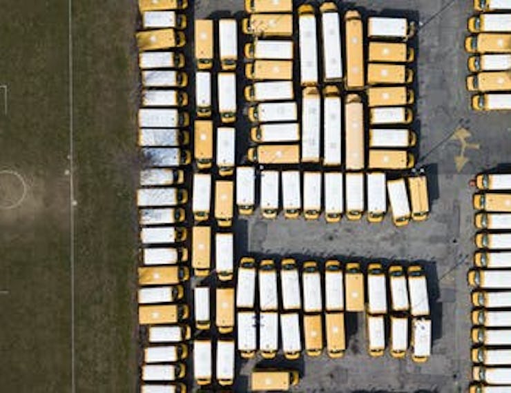 Parked school buses in Freeport, New York, 18 March 2020.
