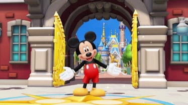 Mickey Mouse stands with his arms opening, welcoming people to Magic Kingdom in the Disney Magic Kin...
