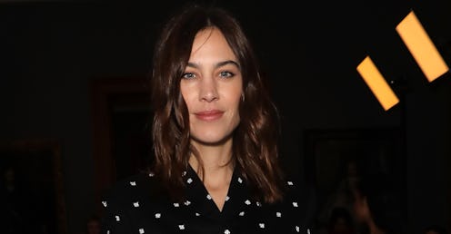 Alexa Chung wearing a black blouse with white dots