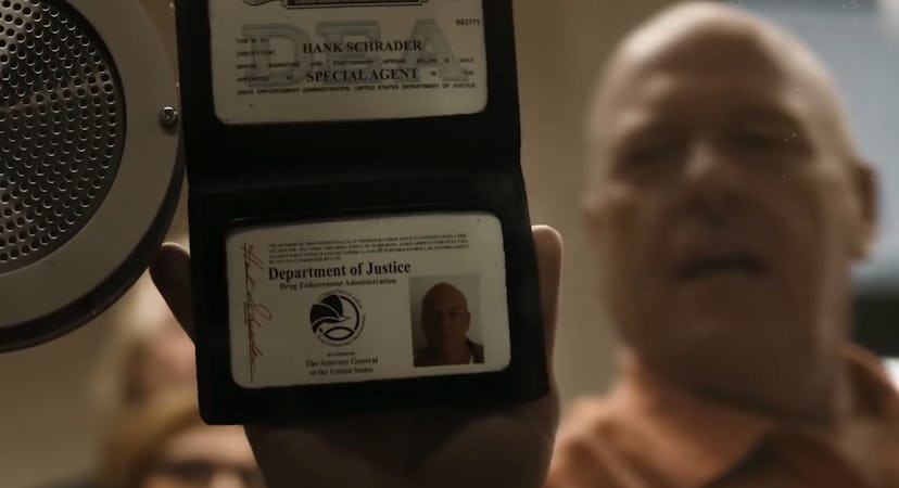 Dean Norris as Hank Schrader holding his DEA identification on Better Call Saul