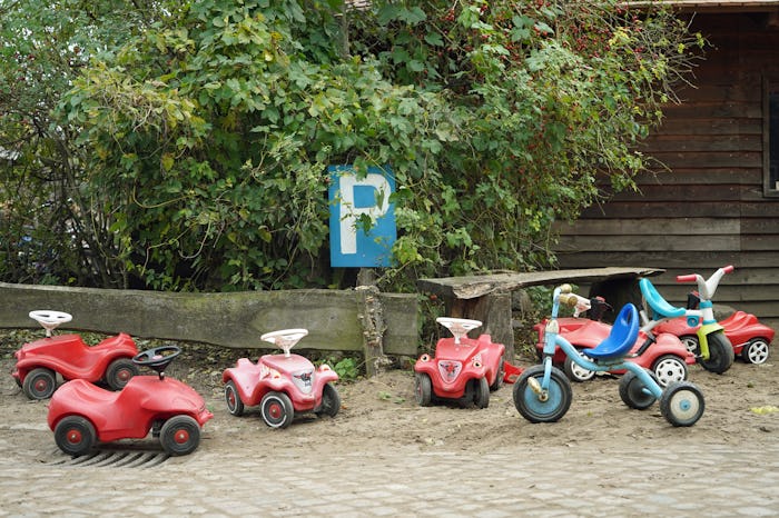 empty toy ride on cars sit parked