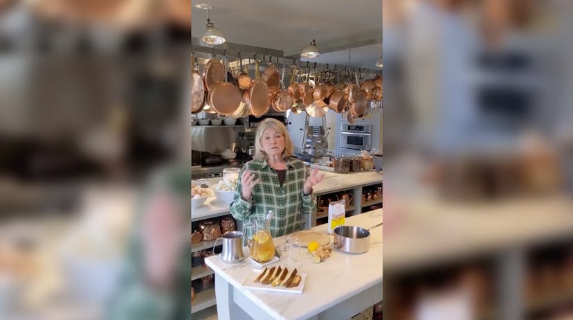 Martha Stewart making a coronavirus cocktail in a kitchen with a ceiling full of hanging copper pots...