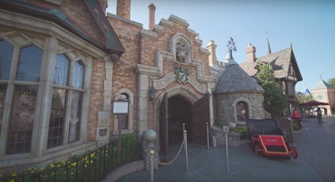 The front entrance to Mr. Toad's Wild Ride at Disneyland has a car parked out front. 
