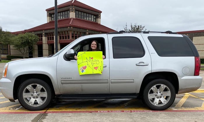 Teacher visits students from afar during school closure