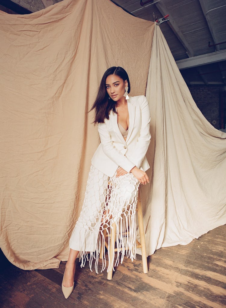 Shay Mitchell wearing 10 Crosby by Derek Lam blazer, skirt, pants; Manolo Blahnik shoes; Annie Coste...