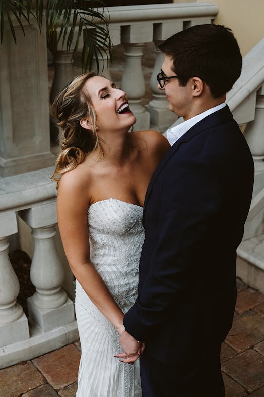 Rachel Varina in Kitty Chen gown smiles and laughs with husband on wedding day