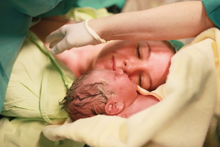 A mother meets her baby after birth