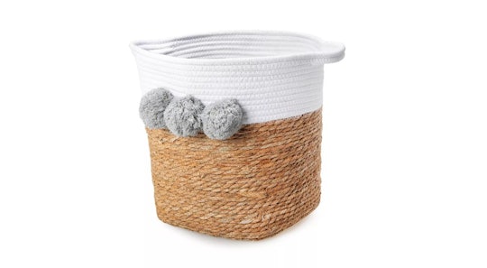 Basket with white across the top, three gray poms, and handles