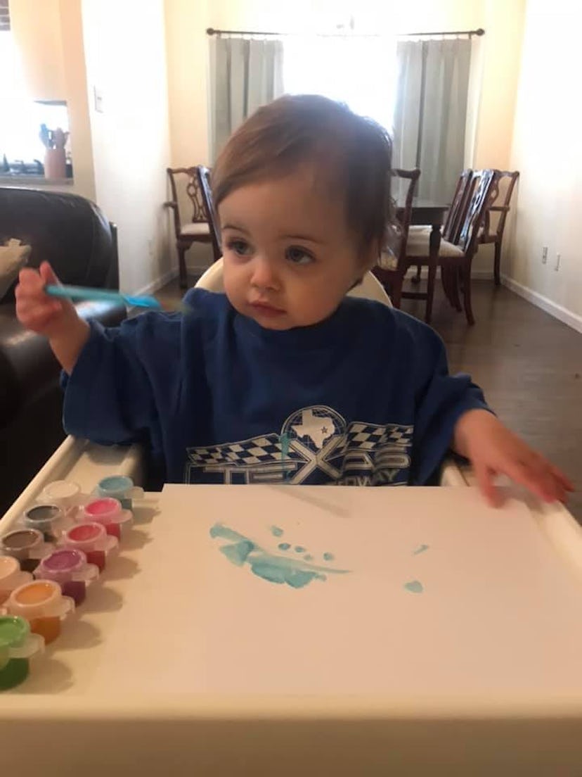 Finger painting in a high chair is one way kids are entertaining themselves during social distancing...