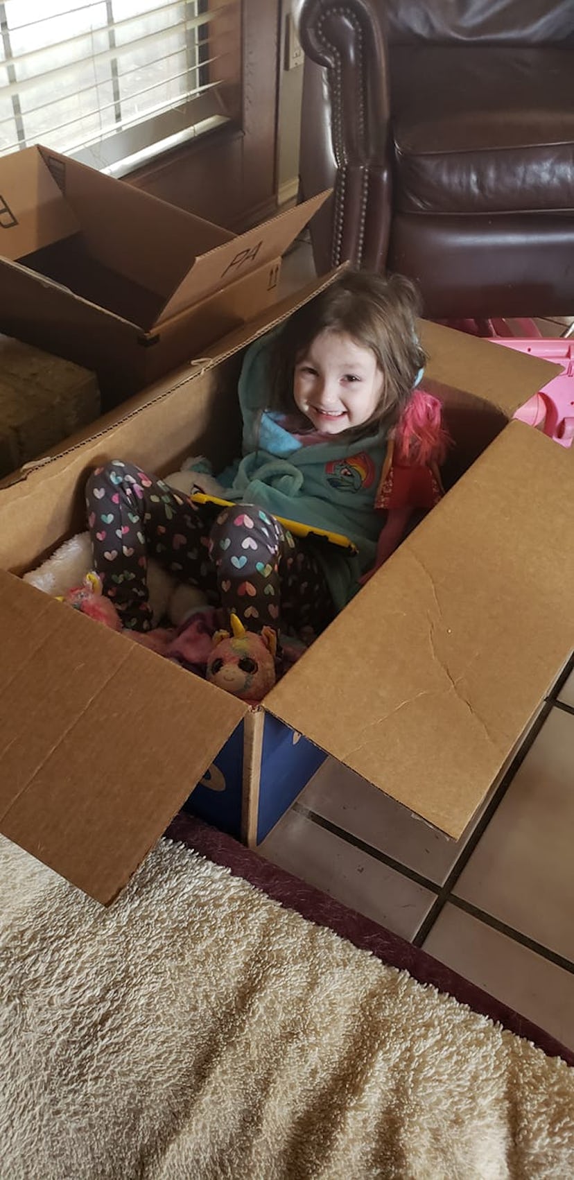 Playing in boxes is one way kids are entertaining themselves during the coronavirus pandemic. 