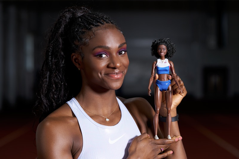 British runner Dina Asher-Smith posing with her very own barbie for IWD 2020