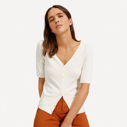 A model wearing a Cotton–Merino Short-Sleeve Cardigan from Everlane's 25% Off Sale 