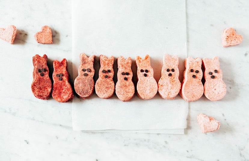 A row of homemade marshmallow peeps in an ombre red/pink lineup