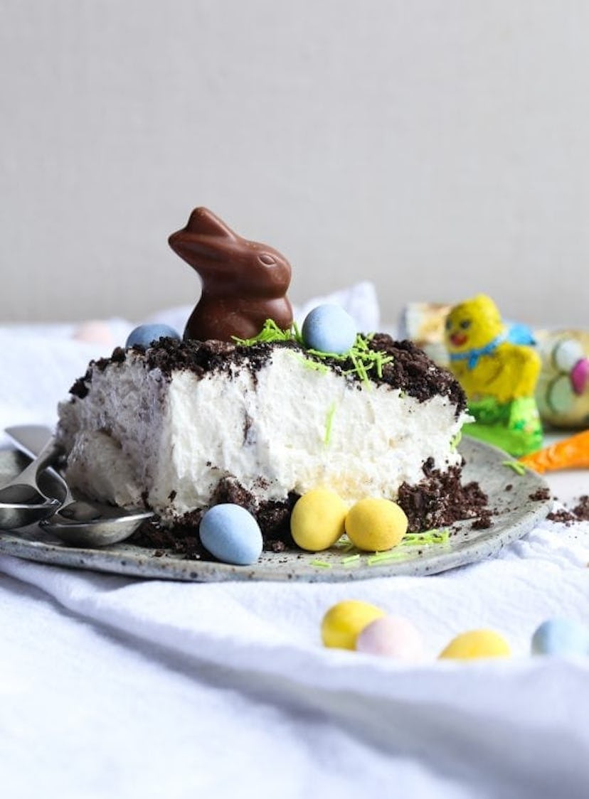 Slice of Easter bunny dirt cake topped with a chocolate bunny and surrounded by chocolate eggs