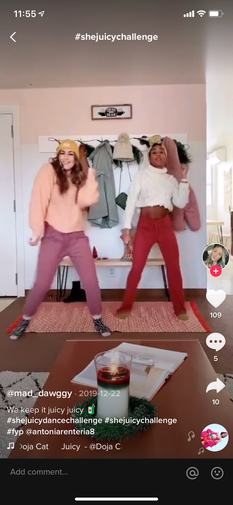 Two best friends do the #shejuicychallenge on TikTok in a colorful room.
