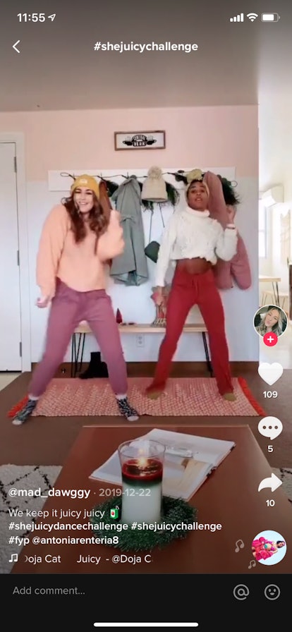 Two best friends do the #shejuicychallenge on TikTok in a colorful room.