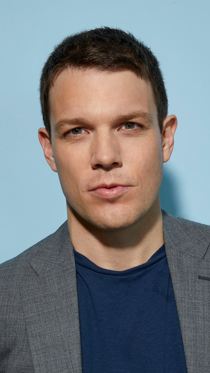 Jake Lacy in gray suit