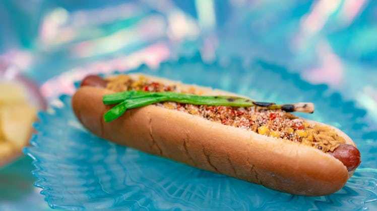 Corn, chili, and cheese sit top off a foot-long hot dog that's served at Disneyland for the "Magic H...