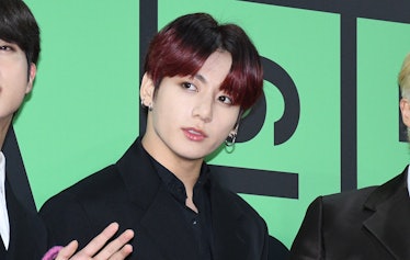 What does BTS' Jungkook's flower tattoo mean? Fans have a theory.